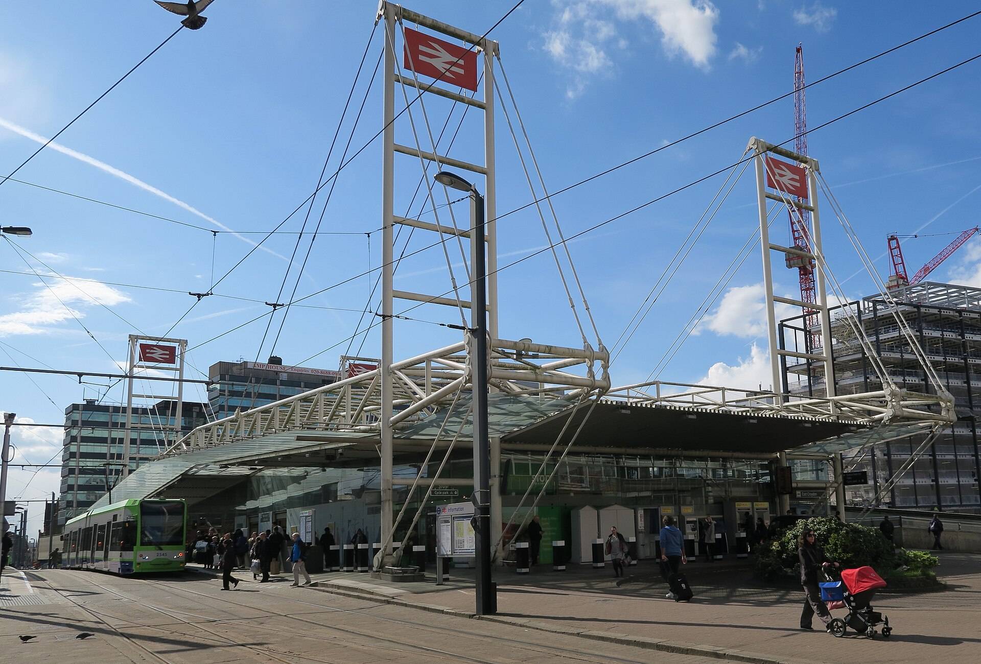 East Croydon station forecourt with a tram at the stop, the departure point for many removals from Croydon